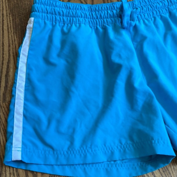 Bright turquoise with white side stripe Nike shorts with pockets, size women’s L - Picture 8 of 16